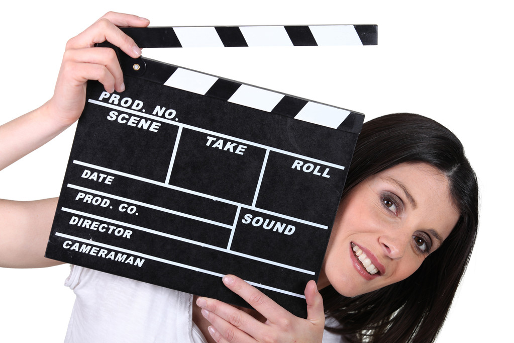 Woman holding a clapper board - Photo, Image