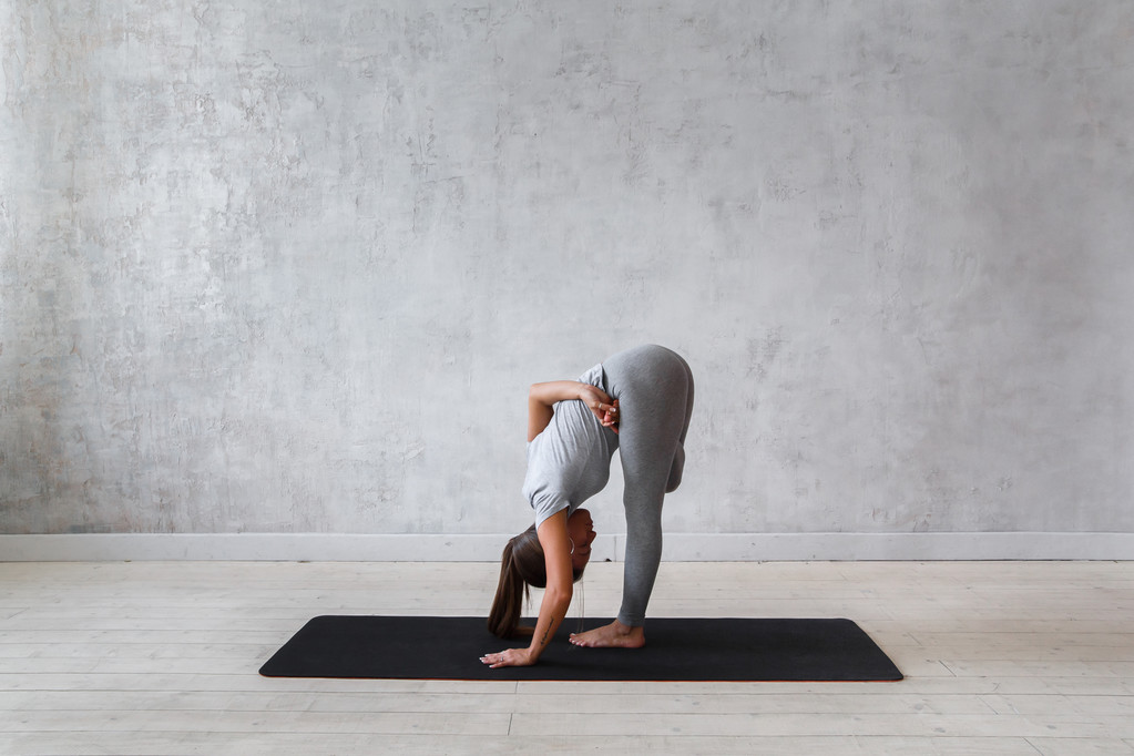 Young woman practicing advanced yoga - Photo, Image