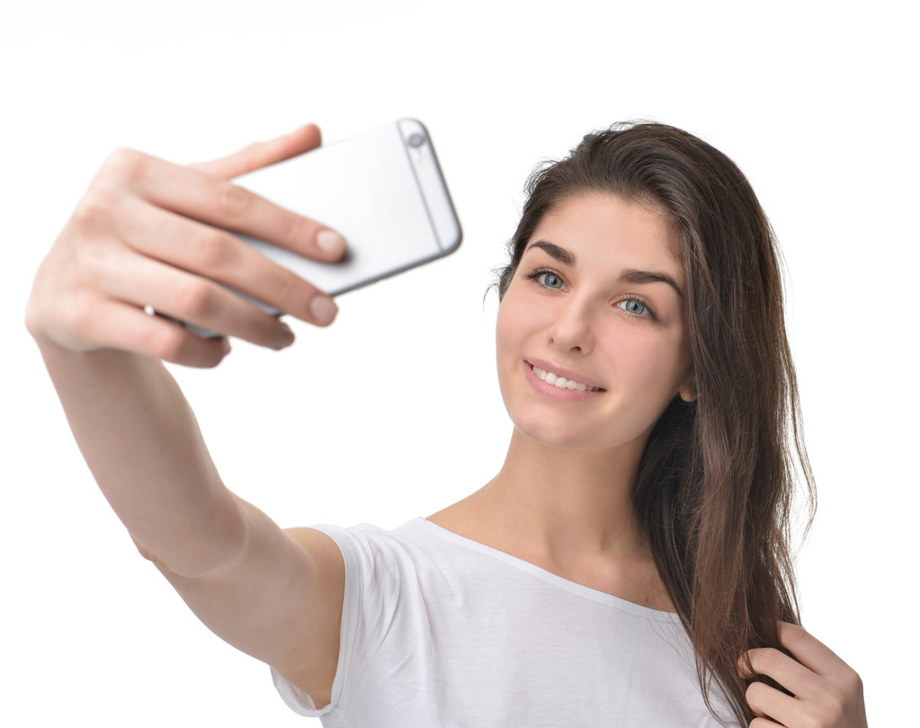 Young pretty woman make self portrait selfie - 写真・画像