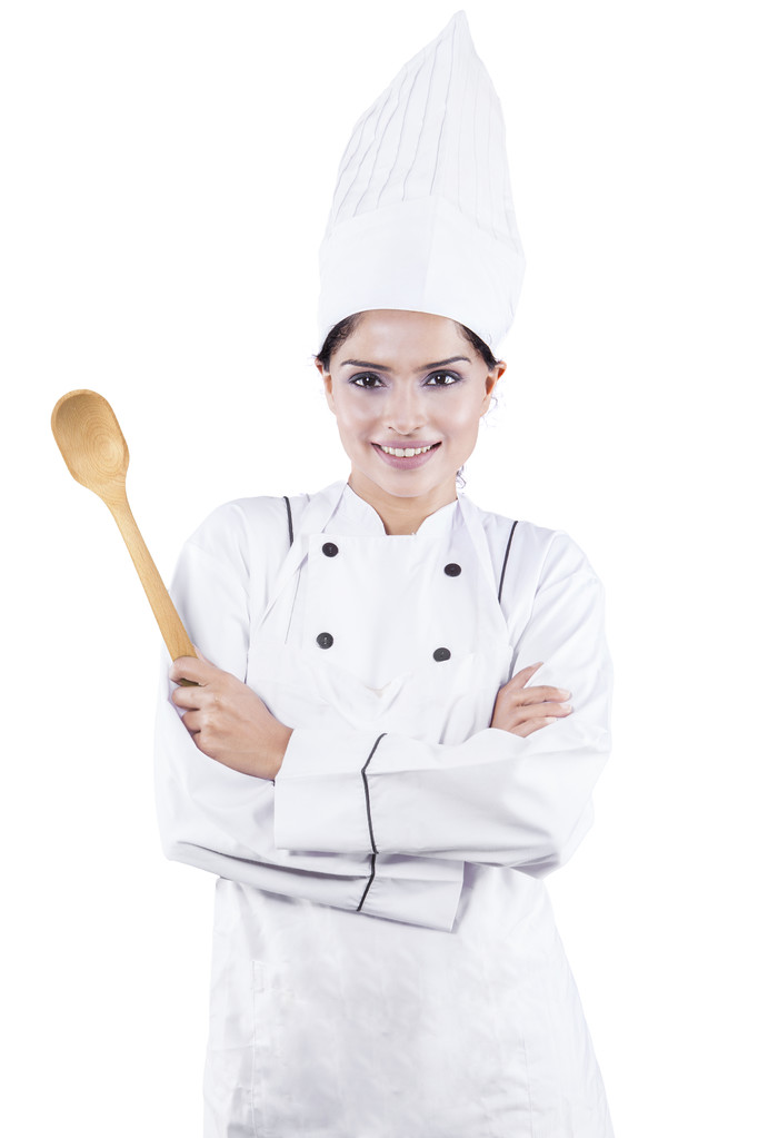 Chef femenino con cuchara en el estudio
 - Foto, imagen