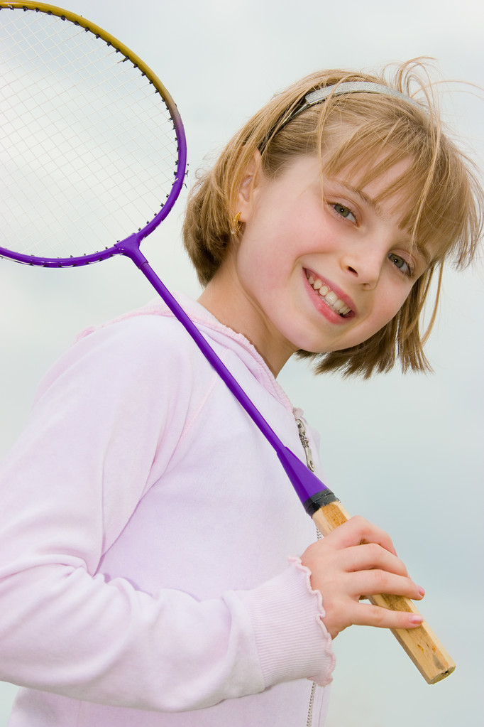 Menina adolescente com raquete de badminton
 - Foto, Imagem