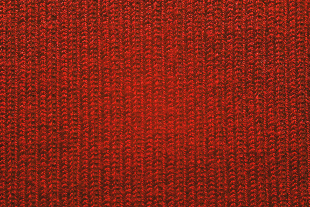 赤の生地。古い編み物、テクスチャ、背景、クローズ アップ - 写真・画像
