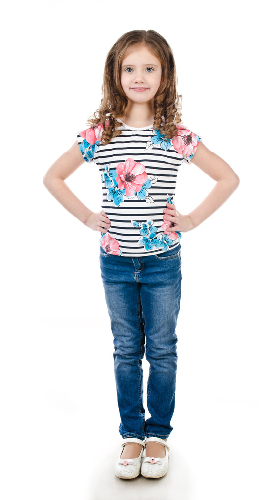 Cute smiling little girl in jeans isolated  - Photo, Image