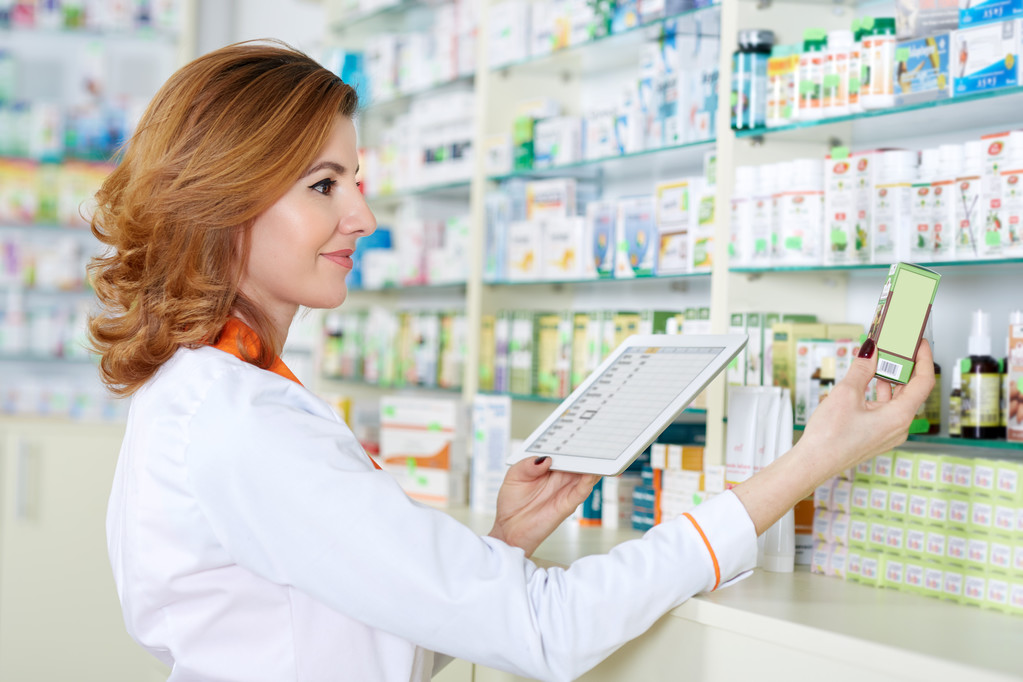 Pharmacist checking correspondence of medicine - Photo, Image
