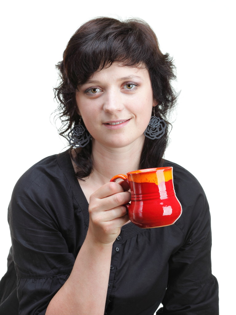 Woman holding a red cup, isolated - Photo, Image