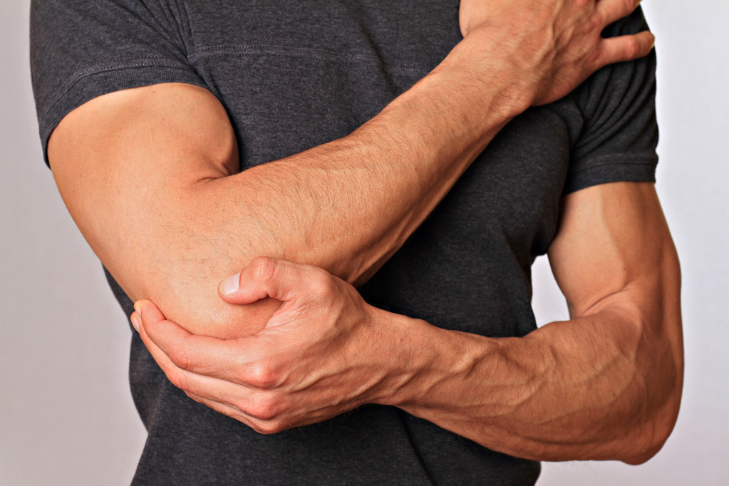 Man With Pain In Elbow. Pain relief concept - Photo, Image