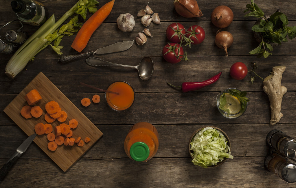 fresh carrots and carrot juice with vegetables on an old wooden table - Photo, Image