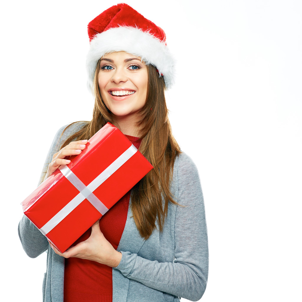 Kobieta w Santa hat trzyma prezent - Zdjęcie, obraz
