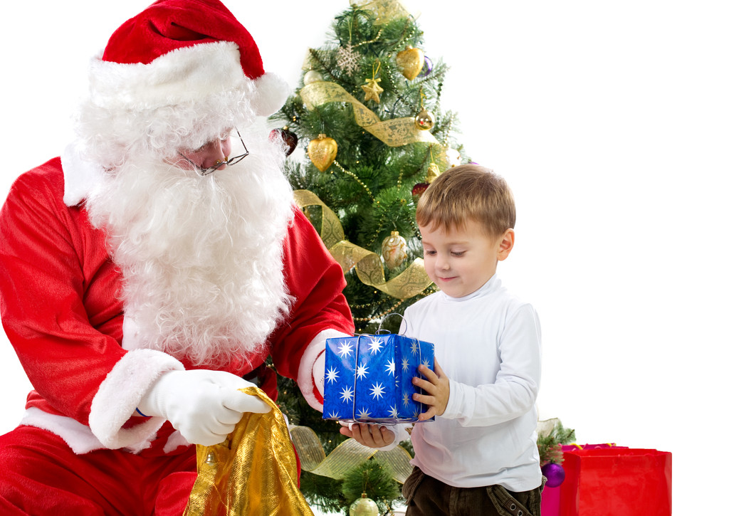Санта-Клаус дарит рождественские подарки ребенку
 - Фото, изображение