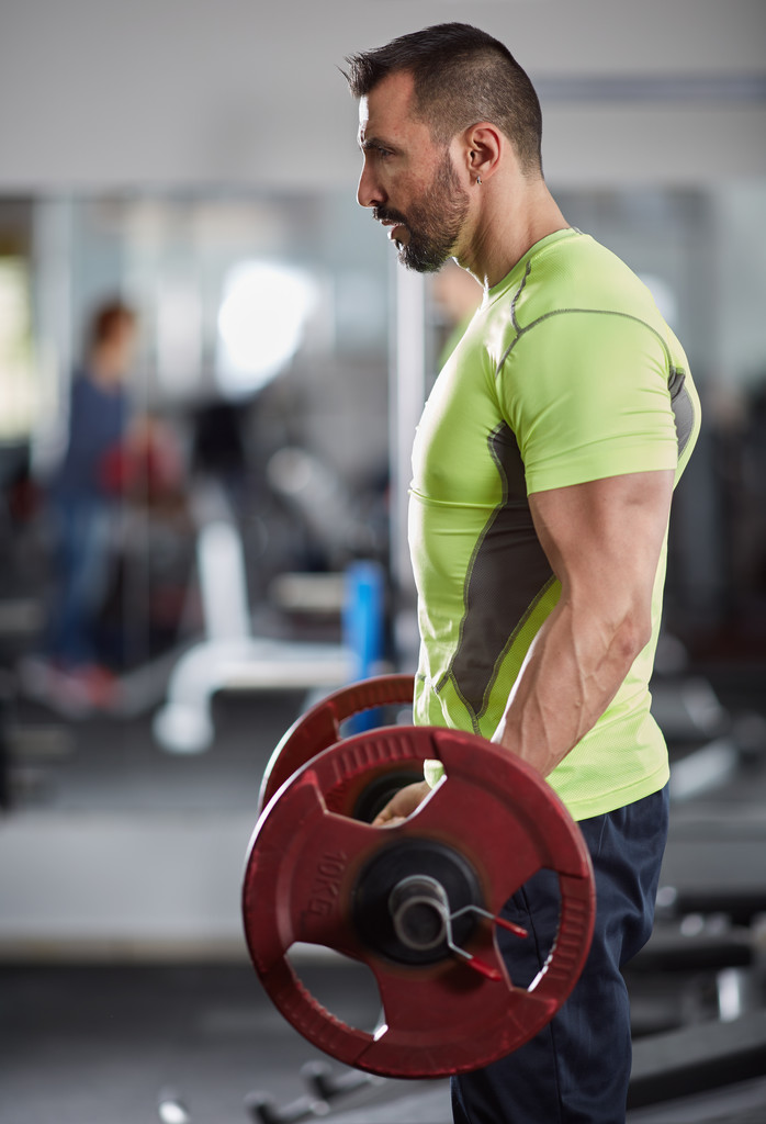 Man doing barbell biceps curl - Photo, Image