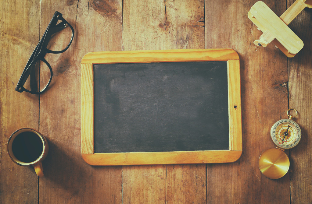 blank blackboard on wooden table. Top view - Photo, Image
