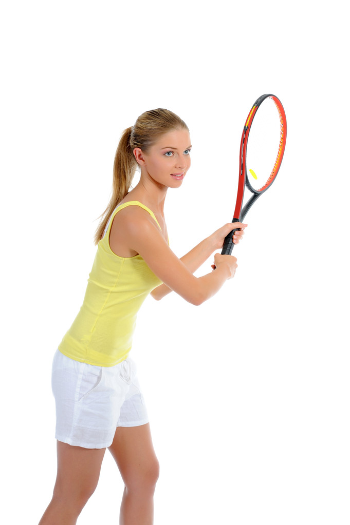 Belle femme avec une raquette de tennis
. - Photo, image