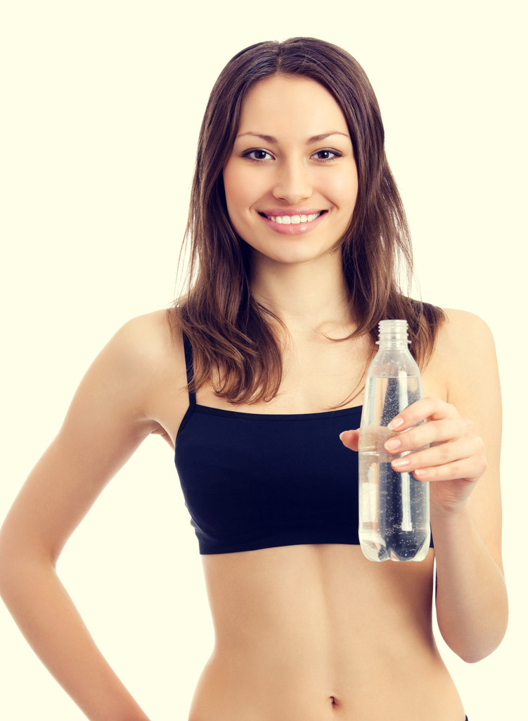 Femme en tenue de fitness avec de l'eau
 - Photo, image