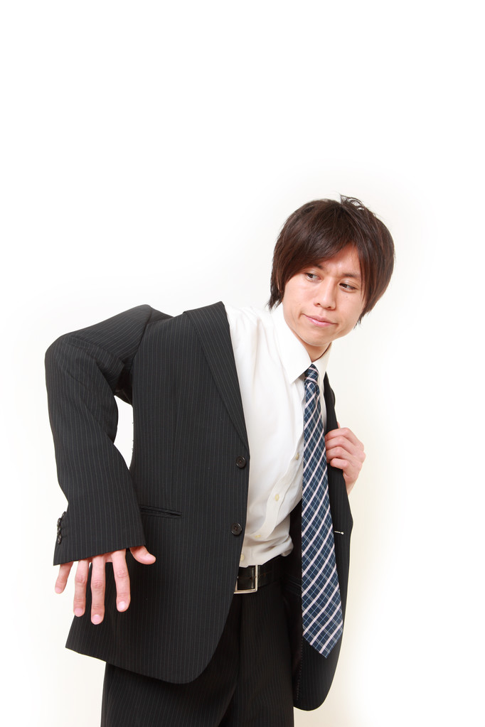 mladý japonský podnikatel se oblékám pro kancelář - Fotografie, Obrázek