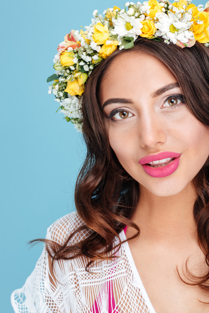 Close-up portrait of an attractive brunette wearing flower diadem - Photo, Image