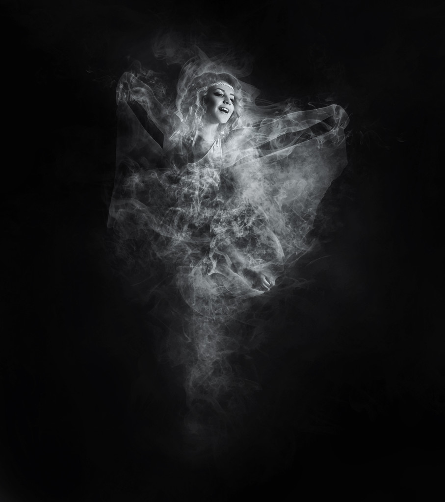 Dancer from smoke on dark - Photo, Image