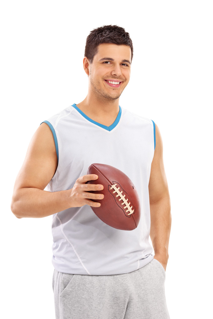 Jeune homme confiant tenant un ballon de football
  - Photo, image