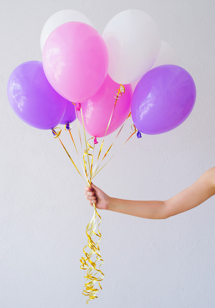 Woman hands holding bunch of balloons - Photo, Image