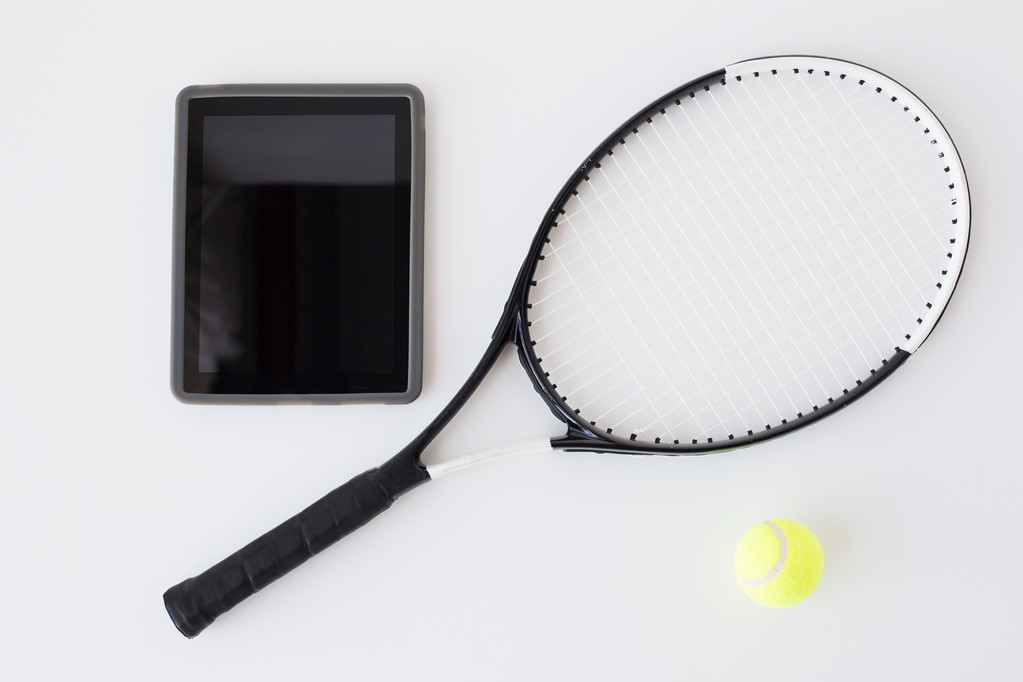 close up of tennis racket with ball and tablet pc - Photo, Image