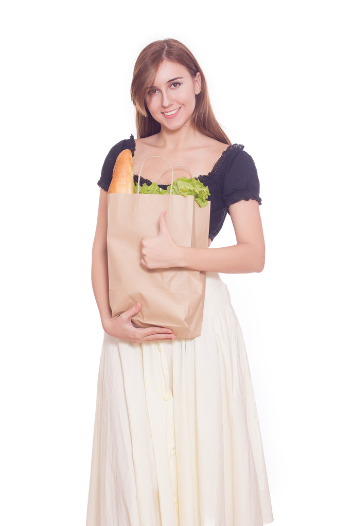 Jeune femme avec sac brun d'aliments et légumes sains
 - Photo, image