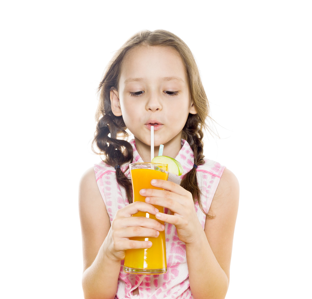 little girl with braids drinking fresh orange juice - Photo, Image