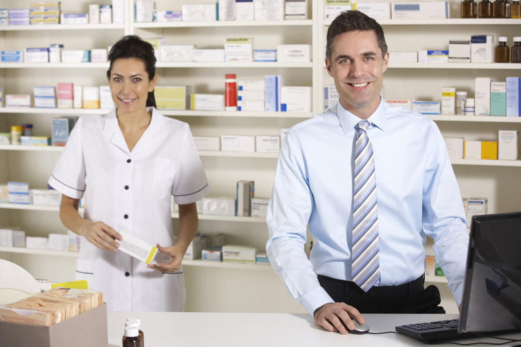 UK nurse and pharmacist working in pharmacy - Photo, Image