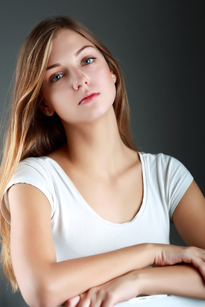 Beautiful young woman in studio looking at camera - Photo, Image