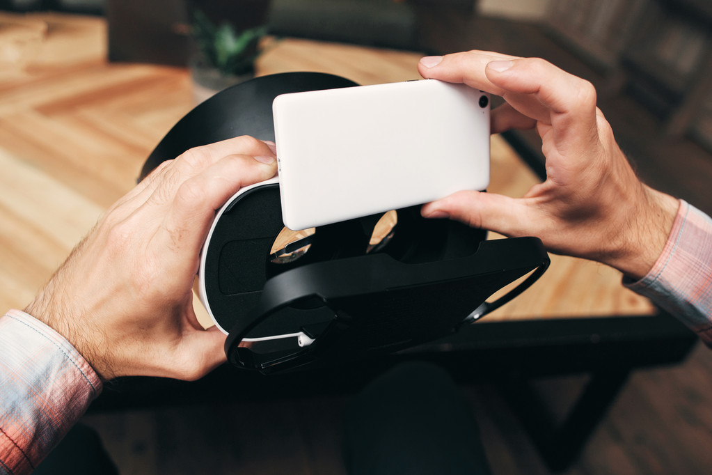 Hands put smartphone to vr headset - Photo, Image