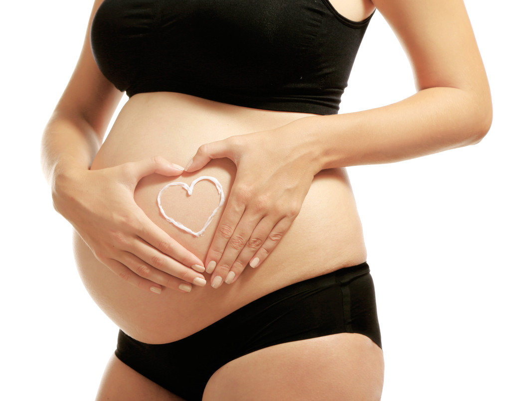 Έγκυος γυναίκα σε λευκό φόντο - Φωτογραφία, εικόνα