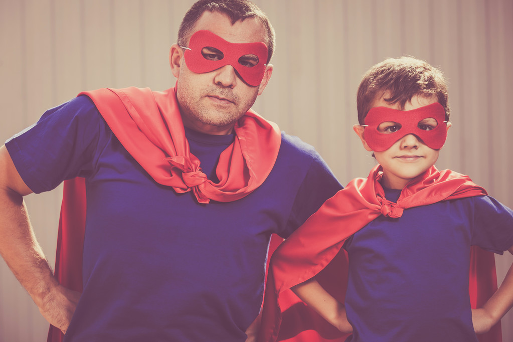Father and son playing superhero outdoors at the day time. - Photo, Image