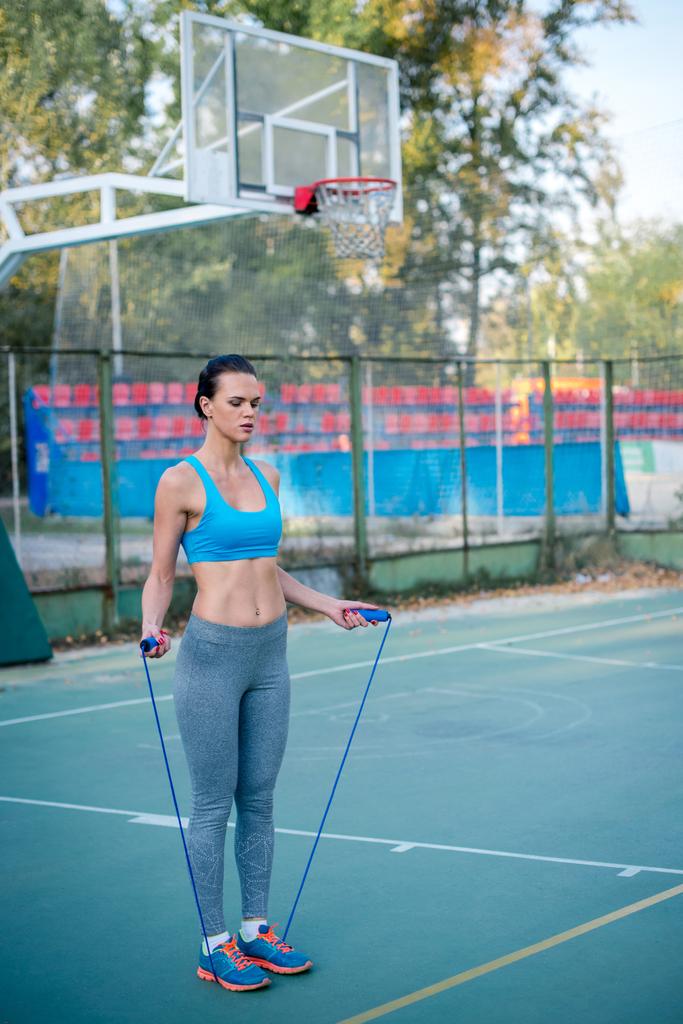 Woman working out with skipping rope  - Photo, Image
