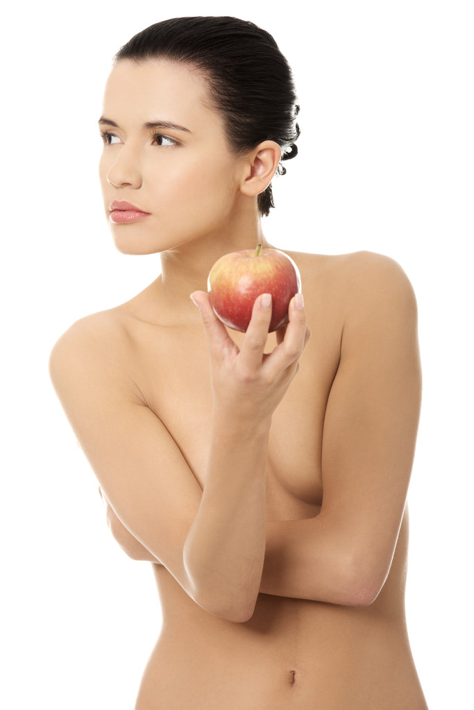 Hermosa mujer sosteniendo manzana roja
. - Foto, imagen