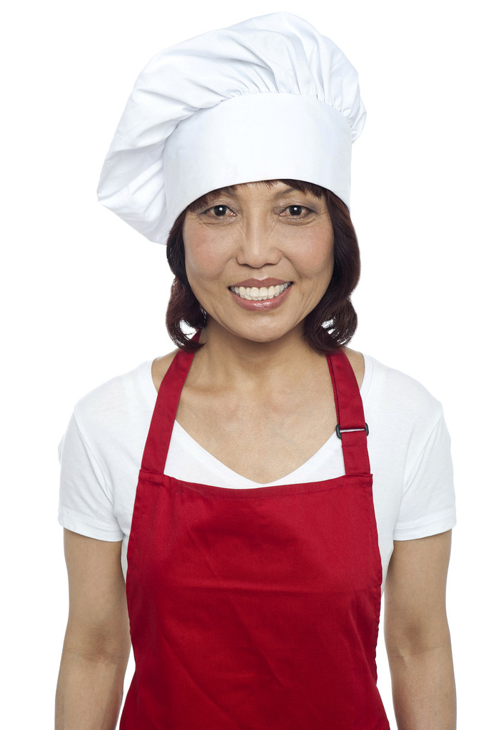 Jovem chef feminino sorridente vestindo avental vermelho
 - Foto, Imagem