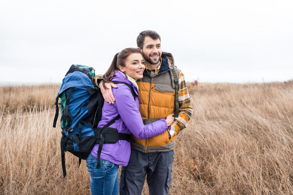 Happy young couple with backpacks - Photo, Image