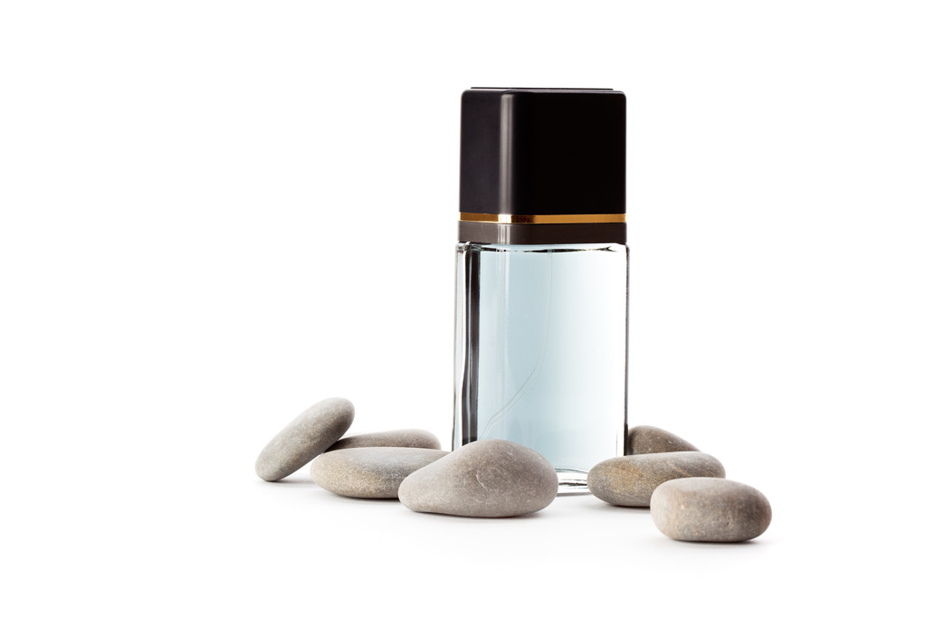 Piedras y frasco con perfume
 - Foto, Imagen