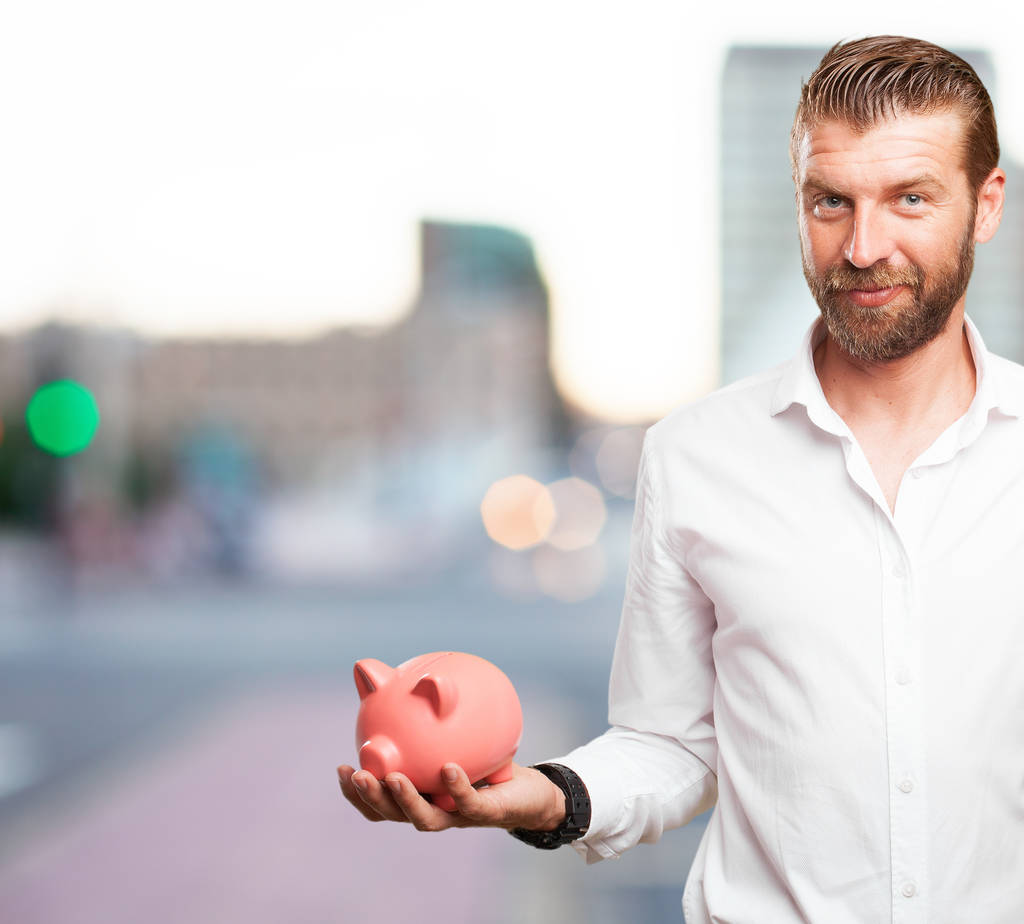 happy young man with piggy bank - Photo, Image