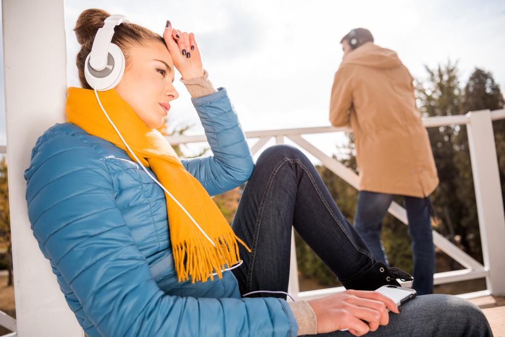 Beautiful woman in headphones listening music  - Photo, Image