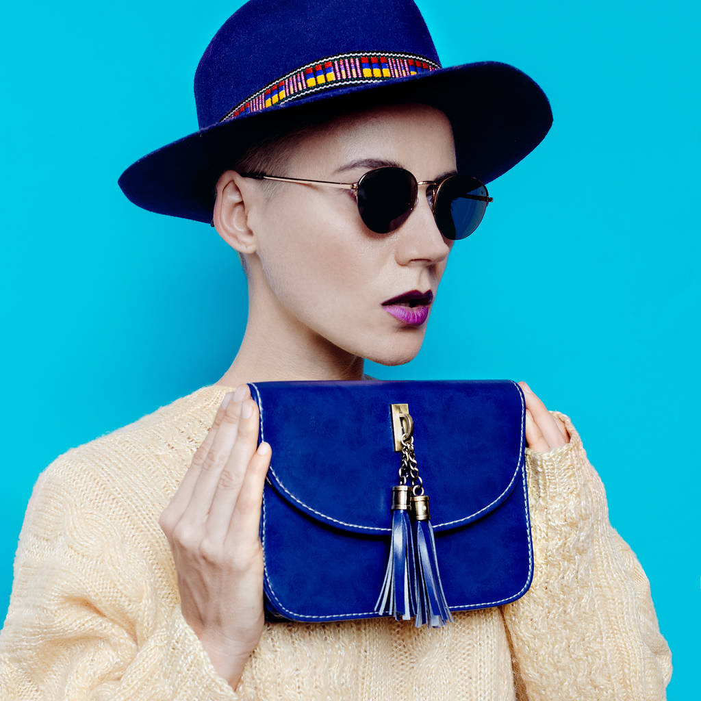 Country model with stylish accessories. Hat, glasses and bag - Photo, Image