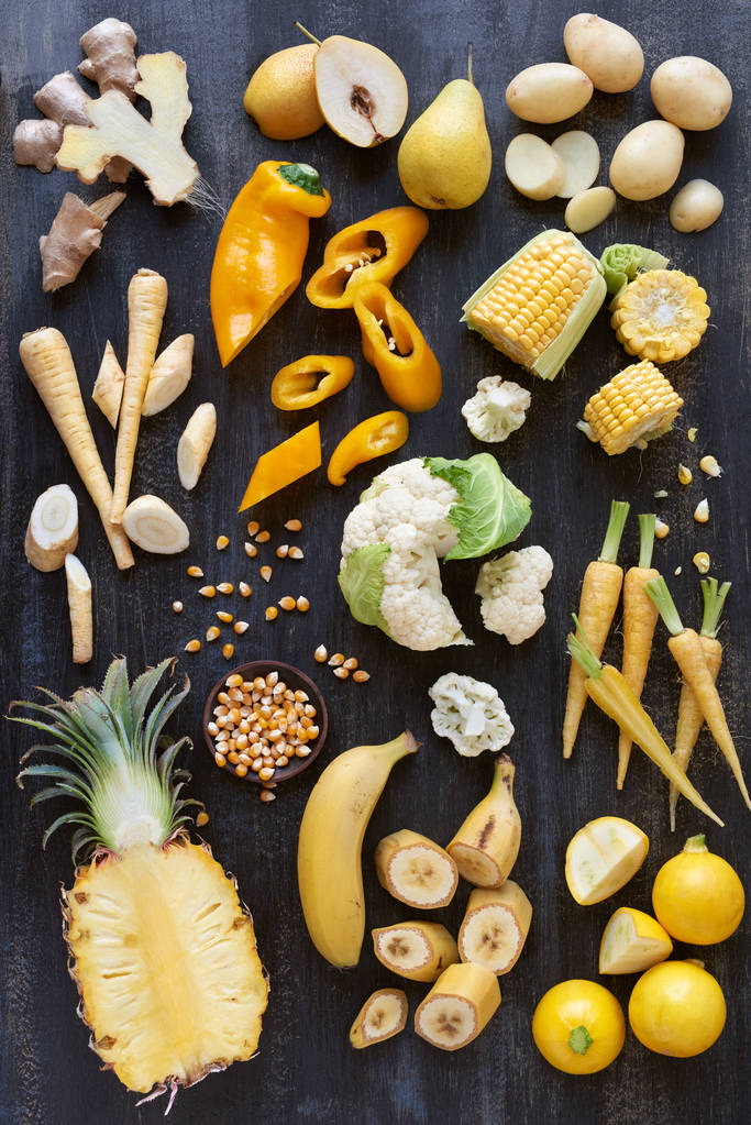 frutas e legumes amarelos tonificados fatias
 - Foto, Imagem