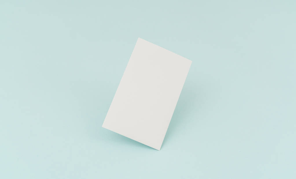 Blank business card on blue background . - Photo, Image
