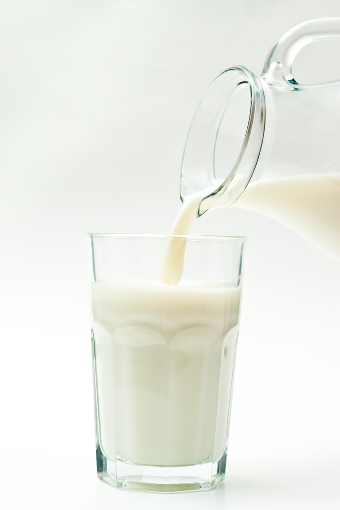 Milk pouring from a jug - Photo, Image
