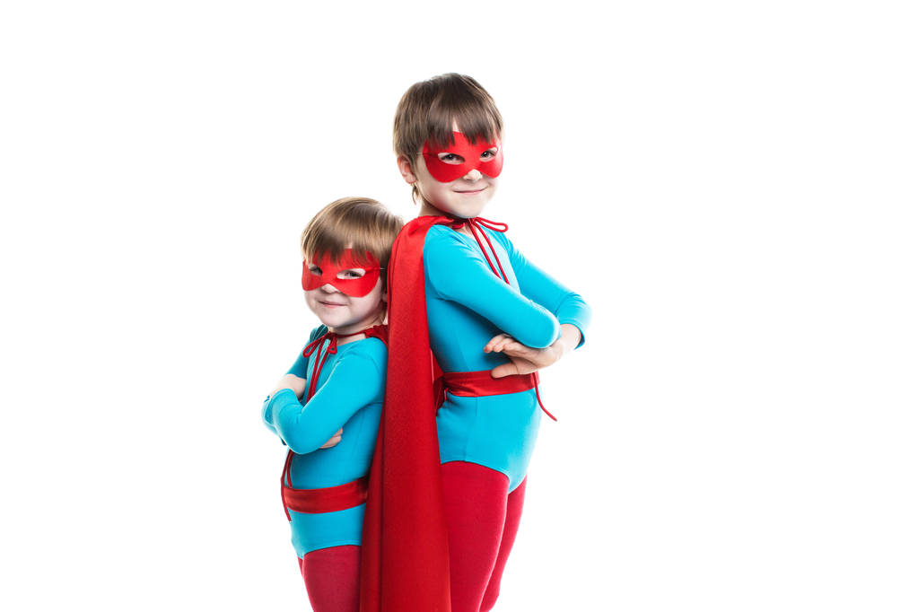 Kids superhero with a mask and cloak look at camera Isolated. - Photo, Image