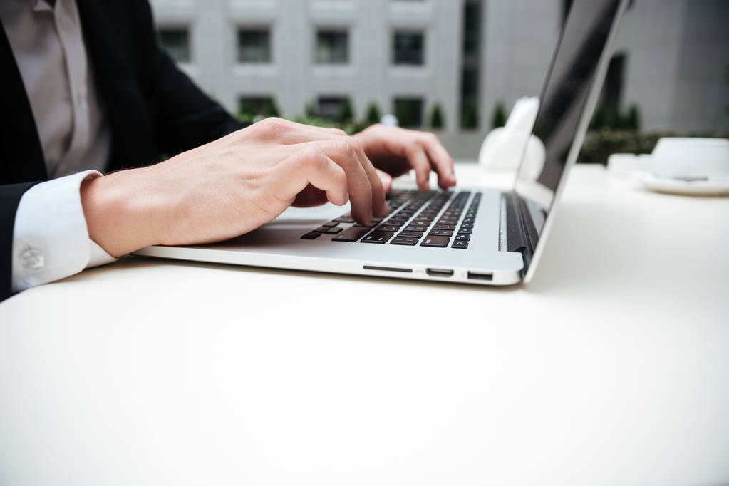 Hands of young businessman using laptop - Photo, Image