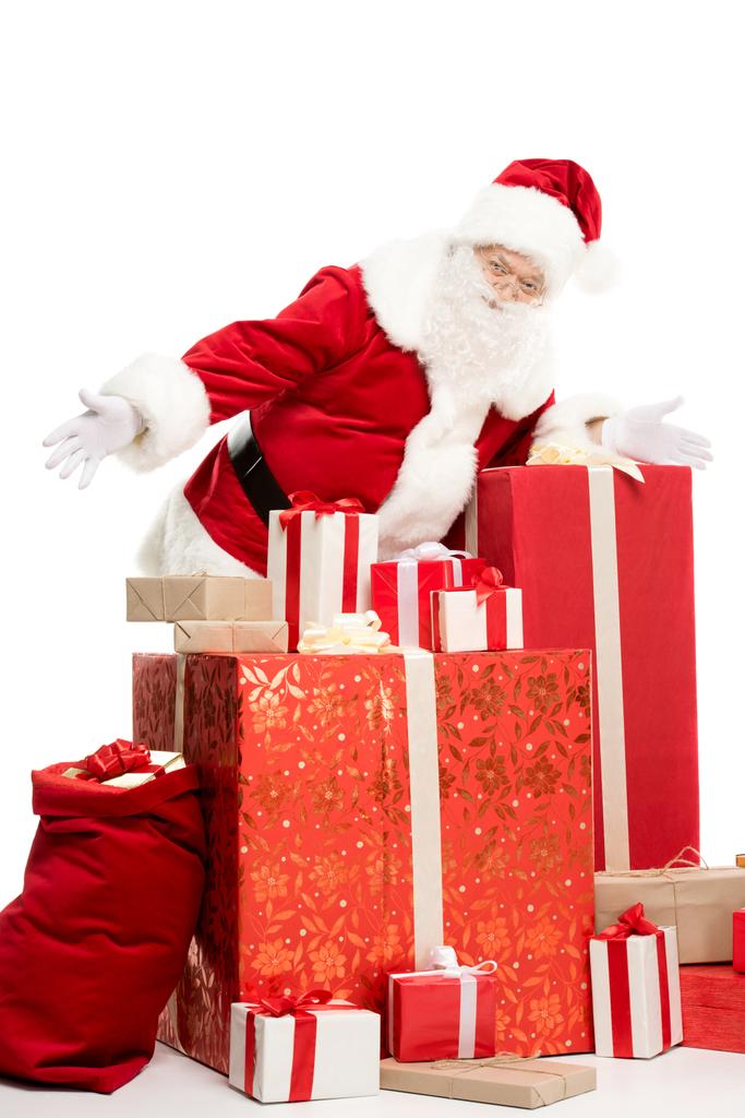 Santa Claus con pila de regalos de Navidad
 - Foto, Imagen
