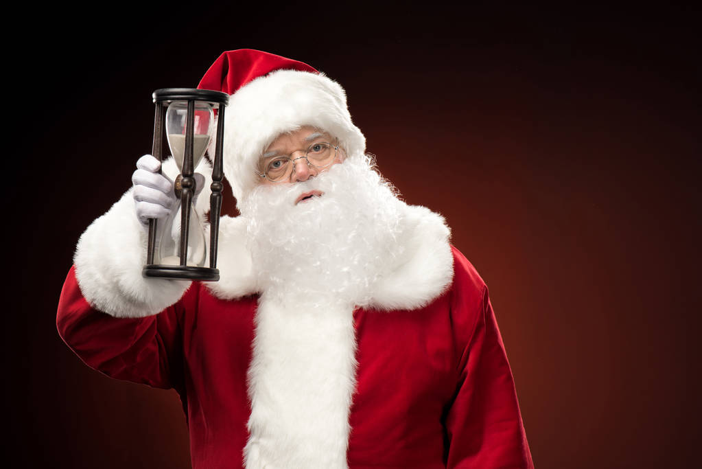 Santa Claus mostrando reloj de arena
   - Foto, imagen