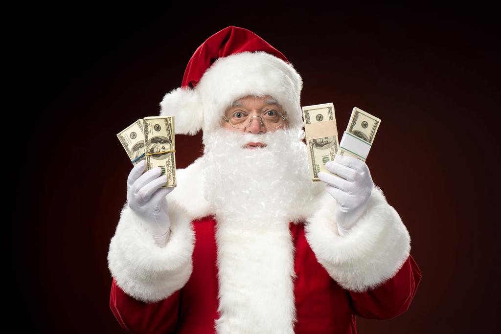Joulupukki dollareineen
 - Valokuva, kuva