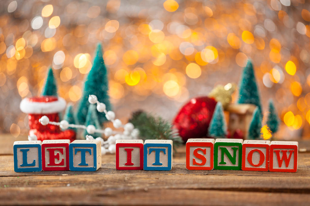 Deixe-o neve escrita com blocos de brinquedo no fundo do cartão de Natal
 - Foto, Imagem