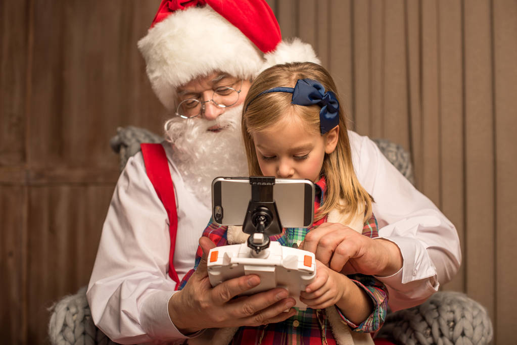 Santa z dzieckiem za pomocą Hexakoptera drone - Zdjęcie, obraz