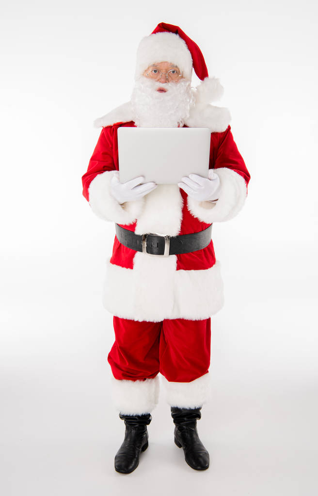 Santa Claus posando con tableta digital
 - Foto, imagen
