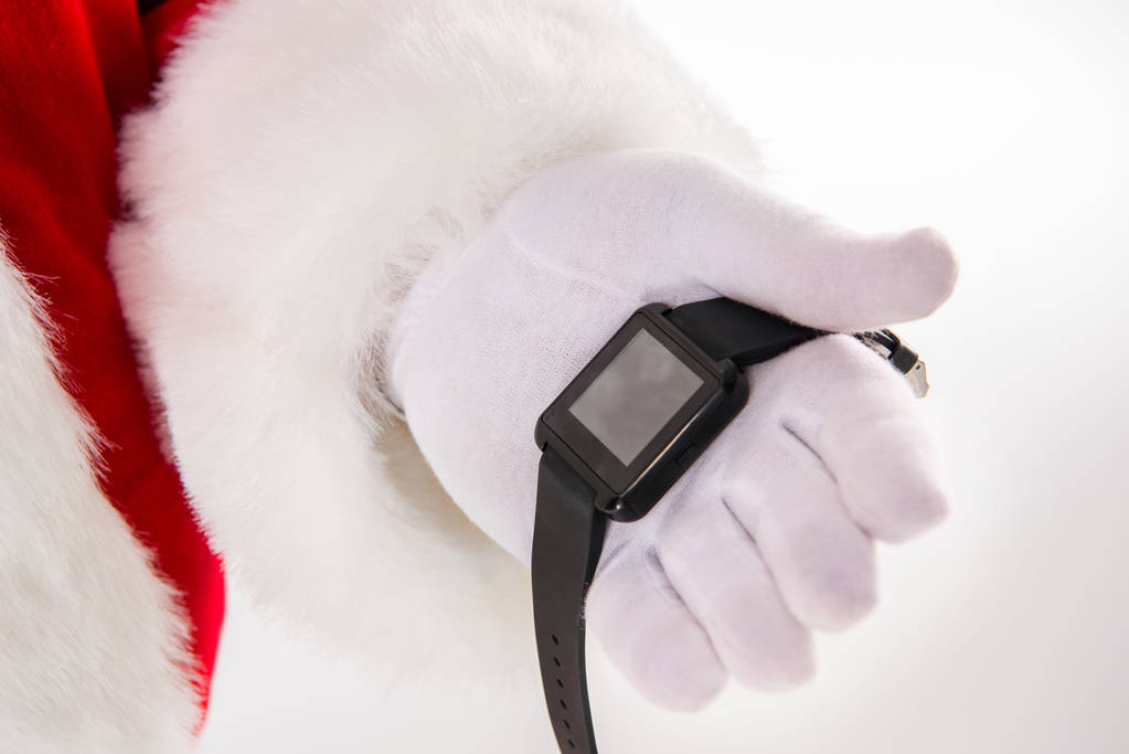 Santa Claus ruku ukazující smart hodinky - Fotografie, Obrázek